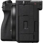 Side view of a black mirrorless camera body with textured grip.