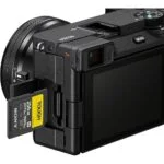 Sony mirrorless camera with memory card inserted, available at Camix UK.