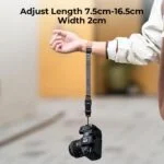 Adjustable camera wrist strap holding a DSLR camera, ideal for secure photography.