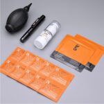 Photography cleaning kit with blower, lens pen, cleaning solution, and wipes.