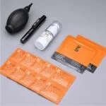 Photography cleaning kit with blower, lens pen, and wipes.