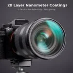 Professional camera with lens featuring 28 layer nanometer coatings for reduced glare.