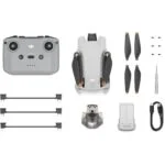 DJI drone with controller, propellers, and accessories from Camix camera shop UK.