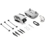 DJI drone with remote, propellers, and accessories from Camix camera shop UK.