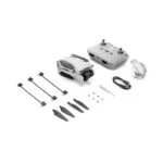 DJI drone with remote, propellers, and accessories from Camix camera shop UK.