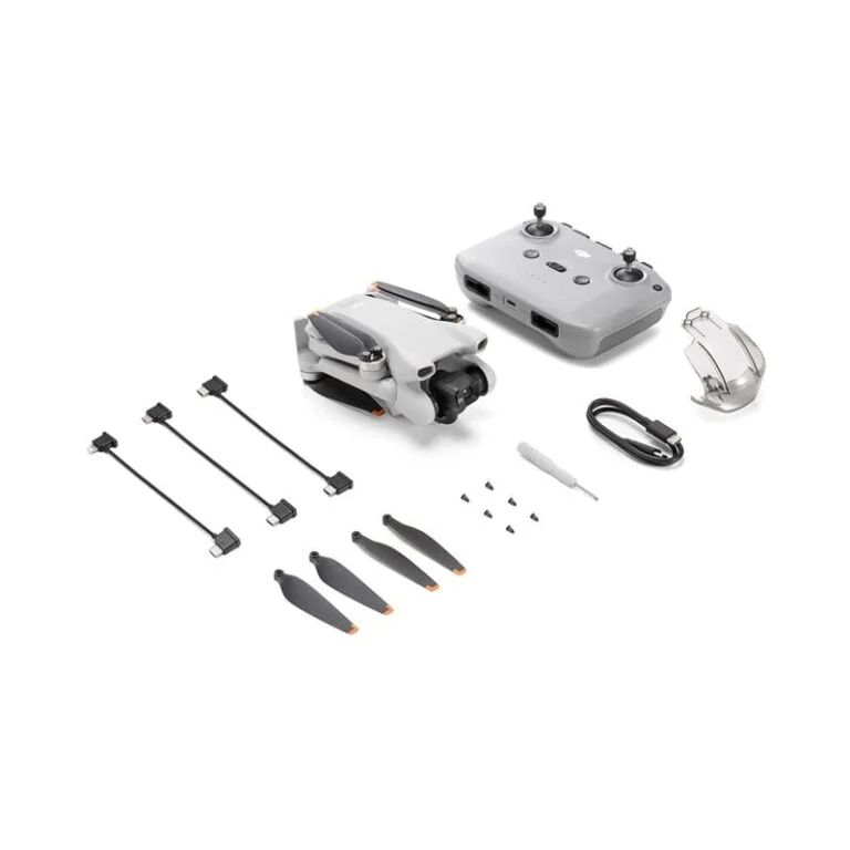 DJI drone with remote, propellers, and accessories from Camix camera shop UK.
