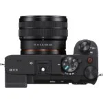 Top view of a Sony mirrorless camera with lens, showcasing controls and dials.