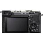 Back view of a mirrorless camera with LCD screen and controls, available at a UK camera shop.