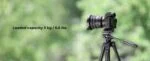 Mirrorless camera on tripod outdoors, showcasing photography gear.