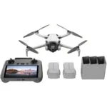 DJI drone with controller, batteries, and charger, available at Camix camera shop UK.