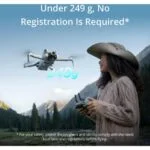 Woman flying a lightweight drone in a scenic landscape.
