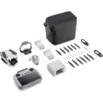 DJI drone with accessories including controller, batteries, propellers, and carrying case.