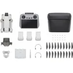 DJI drone with accessories including controller, batteries, propellers, and carrying case.