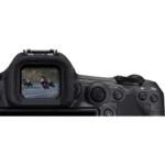Close-up of a digital camera viewfinder showing motorcyclists on a road.