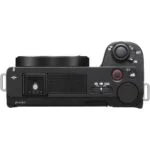 Top view of a mirrorless camera body with control dials and buttons, available at Camix UK.