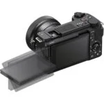 Mirrorless camera with tilting screen and lens, available at Camix UK.