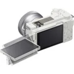 White mirrorless camera with tilting screen, ideal for photography enthusiasts.