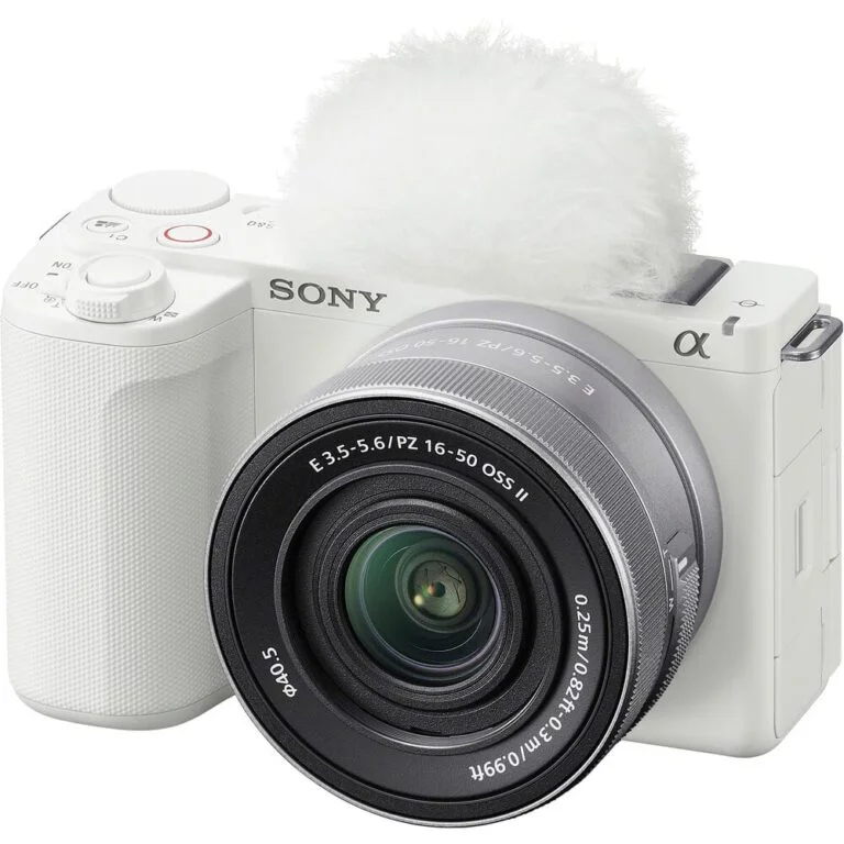 White Sony mirrorless camera with lens, ideal for photography enthusiasts.