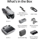DJI Air 3 drone with accessories including propellers, battery, gimbal protector, remote, and charging hub.