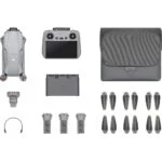 DJI drone with controller, batteries, propellers, and accessories from Camix camera shop UK.