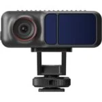 Compact digital camera with lens and mount, ideal for photography and videography.