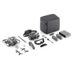 DJI drone with accessories including batteries, controller, and carrying case on display.