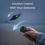 Person controlling a drone with a remote on a beach, showcasing intuitive gesture control.
