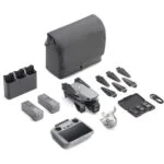 DJI drone with accessories including batteries, propellers, and carrying case from Camix camera shop UK.