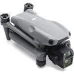 Folded DJI drone with camera, ideal for aerial photography and videography.