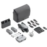 DJI drone with accessories including batteries, propellers, and carrying case on display.