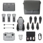 DJI drone with accessories including batteries, propellers, remote, and carrying case.