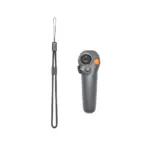 DJI camera remote control with wrist strap for photography equipment.