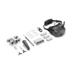 Complete DJI drone kit with drone, controller, goggles, batteries, and accessories.