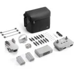 Complete DJI drone kit with accessories including controller, batteries, and carrying bag.