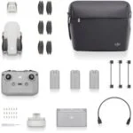 DJI drone with accessories including remote, batteries, propellers, and carrying bag.