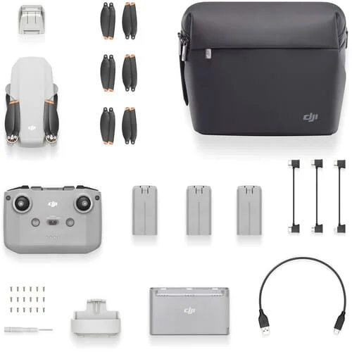 DJI drone with accessories including remote, batteries, propellers, and carrying bag.