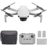 DJI drone with controller, batteries, and carrying case, available at Camix camera shop UK.