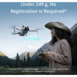 Woman flying a lightweight drone in a scenic landscape.