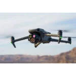 DJI drone flying over a desert landscape, showcasing advanced camera features.