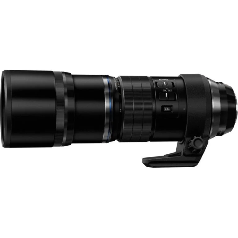 Professional telephoto camera lens with tripod mount for photography gear.