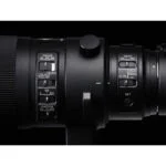 Close-up of a professional camera lens with focus and custom settings, ideal for photography enthusiasts.