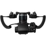 Olympus camera with macro lens and dual flash setup, ideal for professional photography.