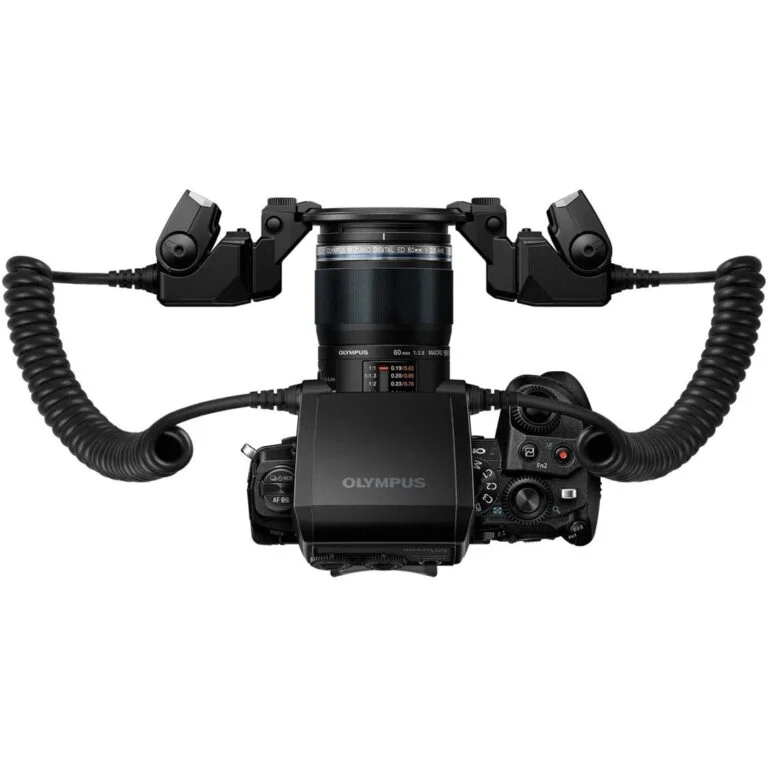 Olympus camera with macro lens and dual flash setup, ideal for professional photography.