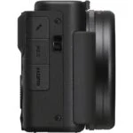 Side view of a compact digital camera body with lens mount.