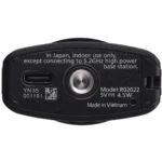 Bottom view of a camera accessory with model details and connection port.