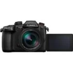 Panasonic Lumix GH5 II mirrorless camera with flip-out screen, ideal for professional photography and videography.