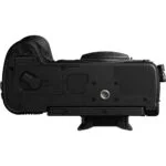 Bottom view of a professional camera body, showcasing tripod mount and battery compartment.