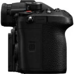 Side view of a professional mirrorless camera body with textured grip.