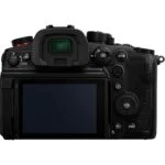 Back view of a professional mirrorless camera with LCD screen and controls.