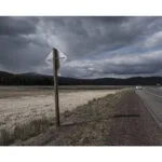 Scenic landscape with road and cloudy sky, ideal for photography enthusiasts.